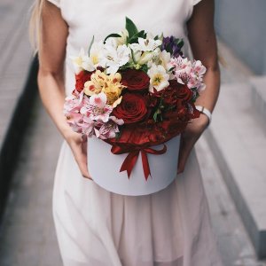 Box of red roses and alstromeries