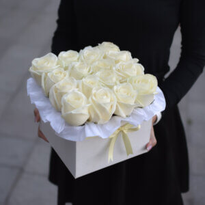 Square box of elegant white roses