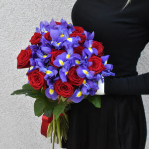 Bouquet of red roses and blue irises